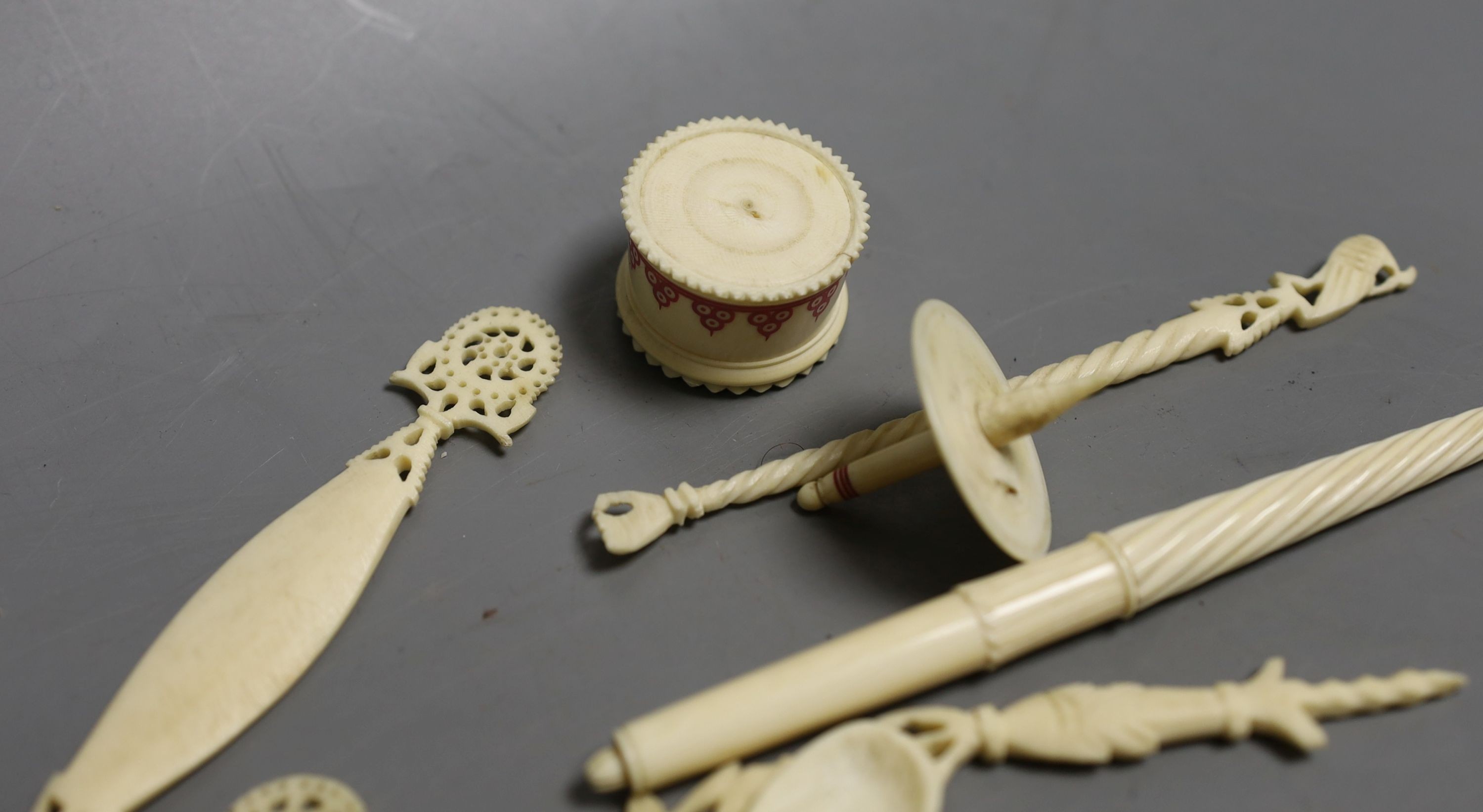 A group of 19th century/early 20th century carved ivory chains, sewing accessories, bracelets etc.